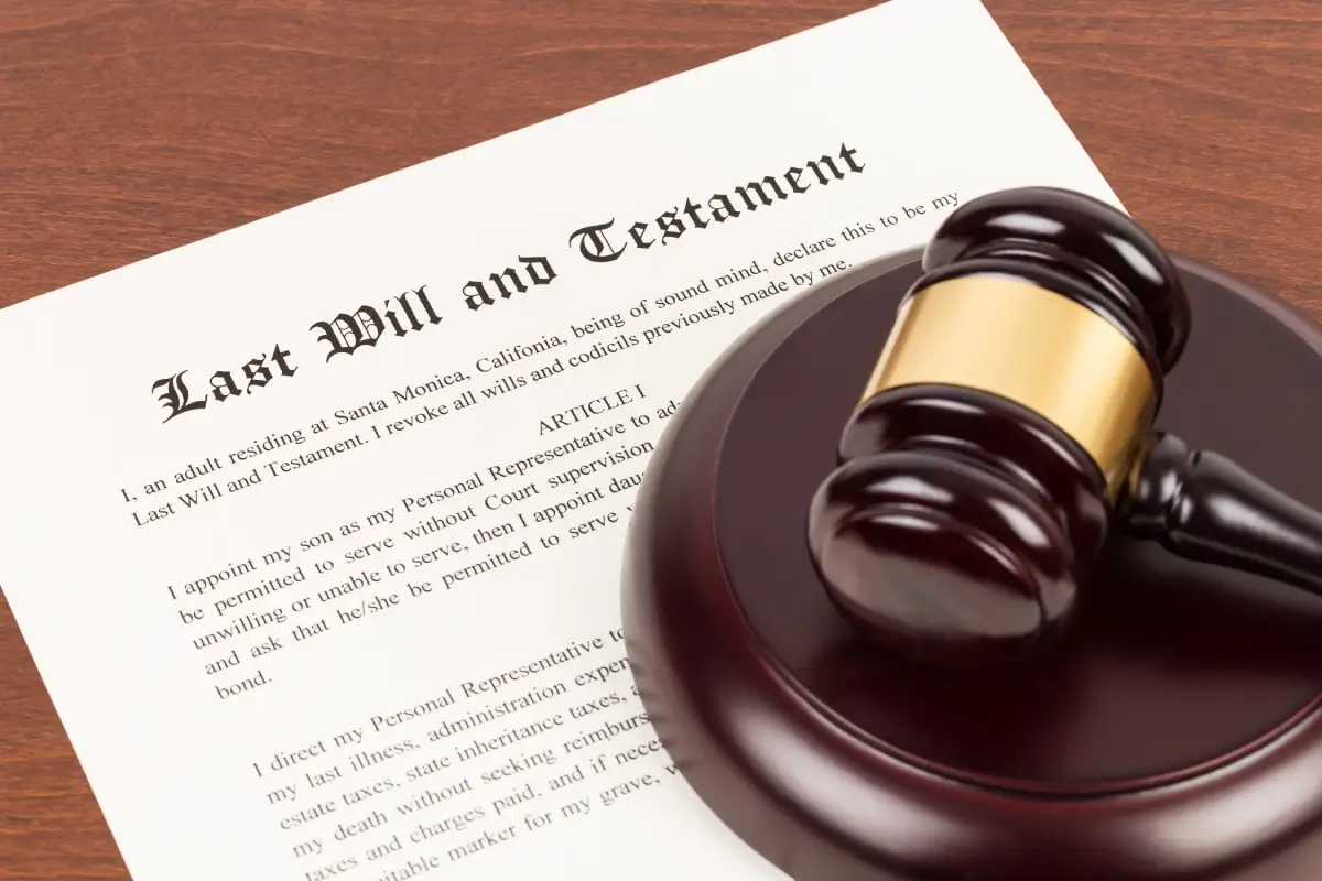 A gavel resting on a last will and testament document.